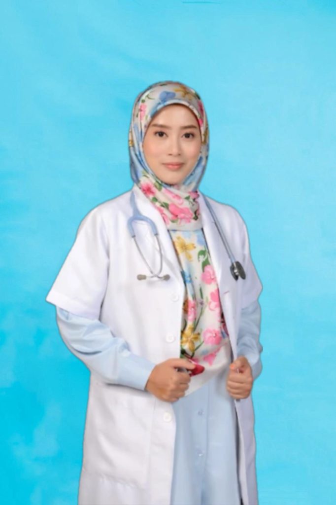 Dr norashikin in white coat and stethoscope in front of a light blue background